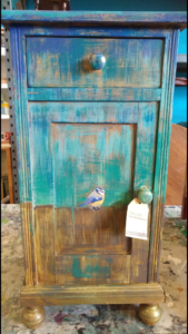 Blue tit on small cabinet